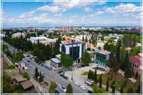 an aerial view of a city with a street and buildings at Premium Hotel Ganja in Ganja