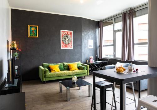 Posezení v ubytování Le Loft Horloger avec parking