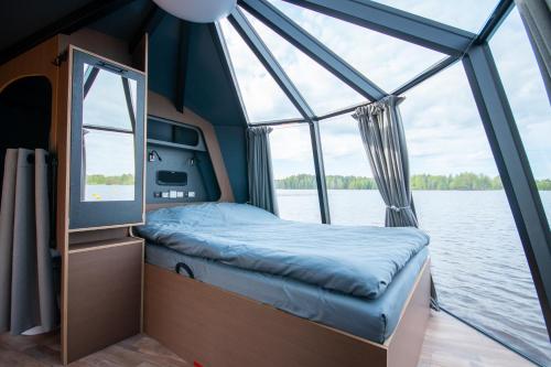 a bed on the back of a boat at Spa Hotel Kunnonpaikka in Kuopio