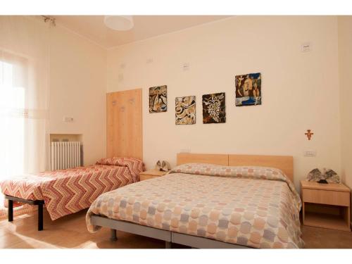 Postel nebo postele na pokoji v ubytování B&B & Residence Pozzo Misseo