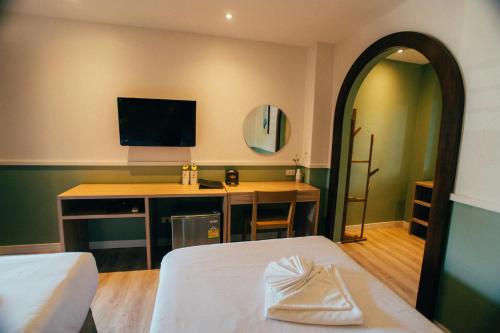 Télévision ou salle de divertissement dans l'établissement Victoria Nimman Hotel