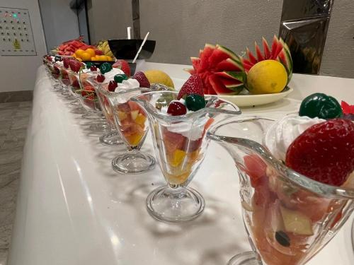 a row of wine glasses with fruit in them on a table at Riviera Zen Hotel Adult Only in Alanya