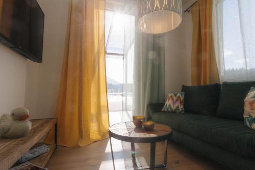 Zona de estar de Forellenhof Appartements & Grossmutters Bungalow