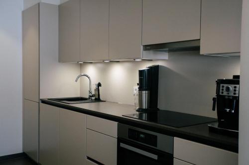Una cocina o zona de cocina en Forellenhof Appartements & Grossmutters Bungalow