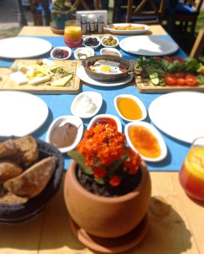 a table full of food on a blue table at Gocek Unlu Hotel in Göcek
