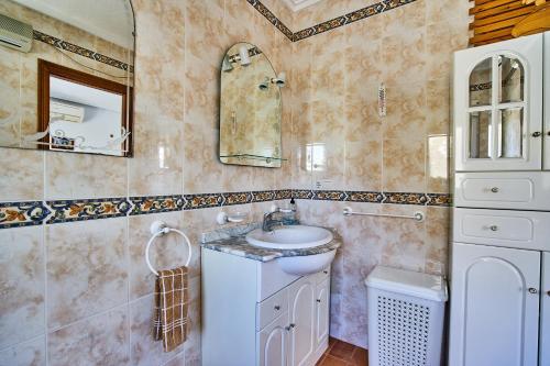 a bathroom with a sink and a mirror at Espanhouse Villa in Ciudad Quesada for 4 in Ciudad Quesada
