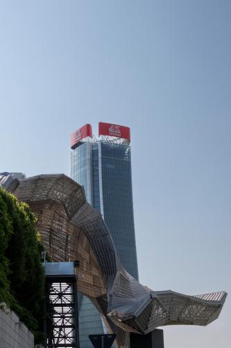a tall building in the background with a building at Mokinba Hotels Montebianco in Milan