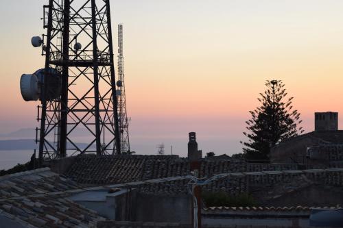 a view of the sunset from the roof of a building at SAN FRANCESCO 67 - Erice Vetta in Erice