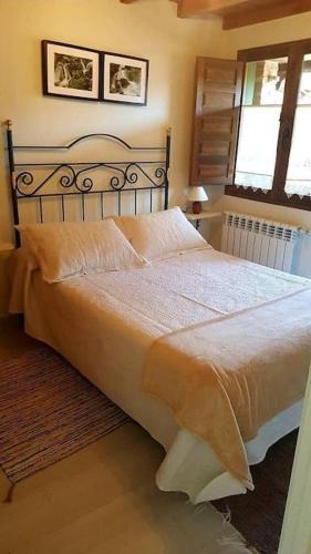 a bedroom with a large bed in a room at Casa La Cabiana in Rotella