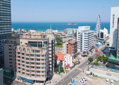 an aerial view of a city with the ocean at Sokcho Good Morning Hotel and Resort in Sokcho