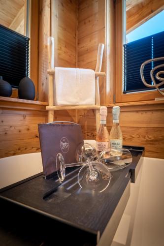 a table with two bottles on it in a room at Mountain Chalet R in Berwang