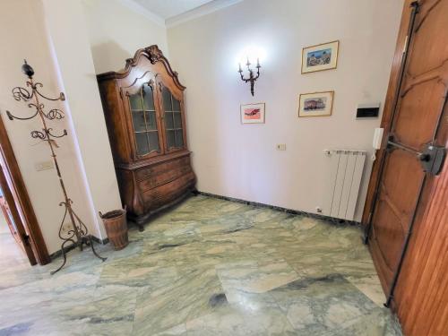 a hallway with a door and a stone floor at Appartamento Pilloa in La Spezia