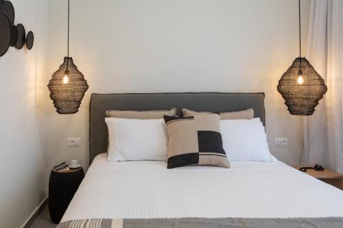 Katil atau katil-katil dalam bilik di Anemelia Luxury Apartments