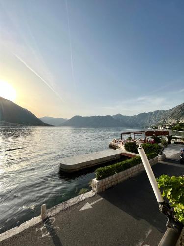 a view of a body of water with a dock at Apartments Dijana in Kotor