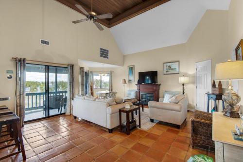 a living room with two couches and a tv at Blue Paradise in Destin