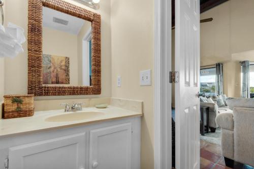 a bathroom with a sink and a mirror at Blue Paradise in Destin