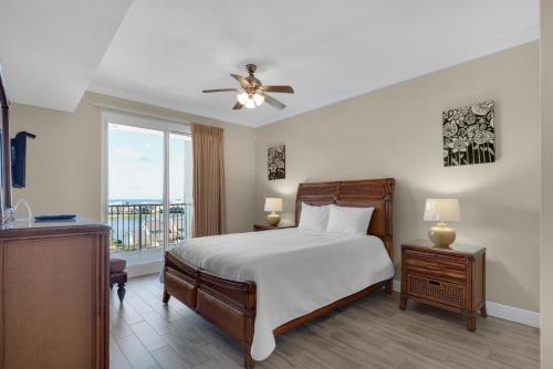 a bedroom with a bed and a ceiling fan at Ariel Dunes II 704 in Destin