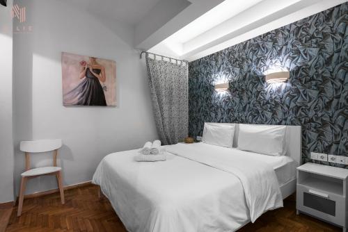 Rustique, Nilie Hospitality MGMT tesisinde bir odada yatak veya yataklar