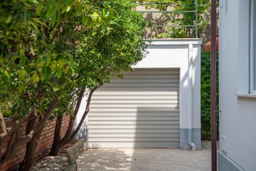 a garage door in the side of a house at Magnificent Villa Sanremo in Sanremo