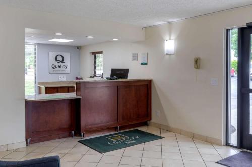 an empty waiting room with a reception desk in a hospital at Quality Inn - Roxboro South in Roxboro