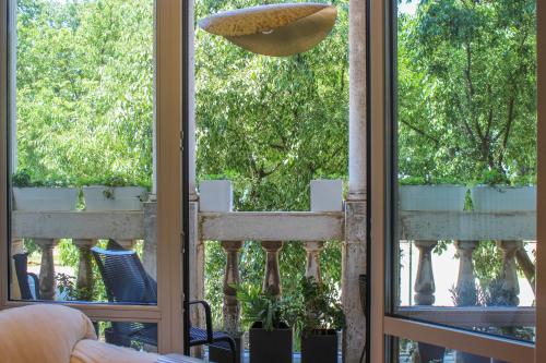 a view from the living room looking out onto the garden at Valsabbion Deluxe City Suite in Pula