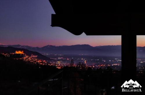 a view of a city at night from a window at B&B Bellavista in Celano