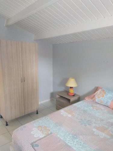 Postel nebo postele na pokoji v ubytování Résidence Naturelle pour Naturistes