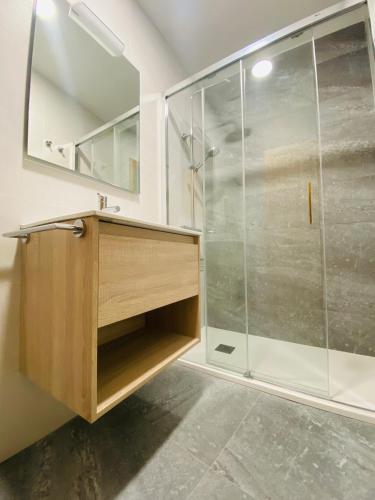 a bathroom with a shower and a sink at Noreas Centro Lucus Augusti in Lugo