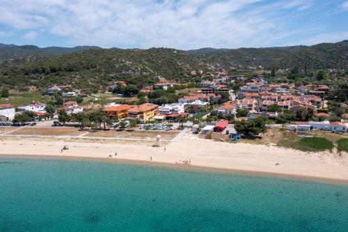 an aerial view of a beach with houses at Studios Halkia in Toroni
