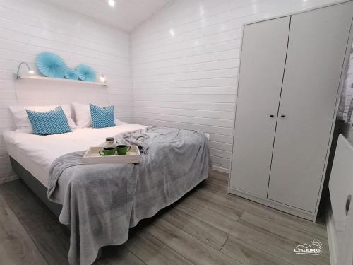 Ένα ή περισσότερα κρεβάτια σε δωμάτιο στο CzaDomki