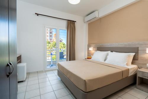 Postel nebo postele na pokoji v ubytování Hotel Grekas