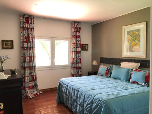 Ένα ή περισσότερα κρεβάτια σε δωμάτιο στο Posada La Serena