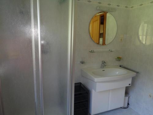 a bathroom with a sink and a mirror at Althuberhof in Planca di Sopra