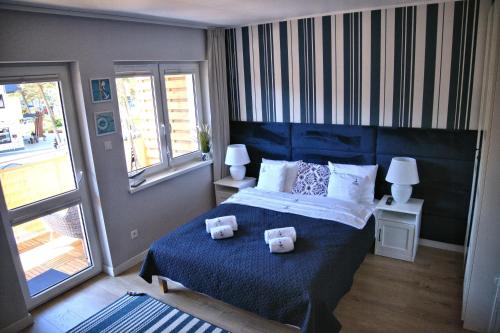 Postel nebo postele na pokoji v ubytování Apartamenty Marynarskie 100m od plaży