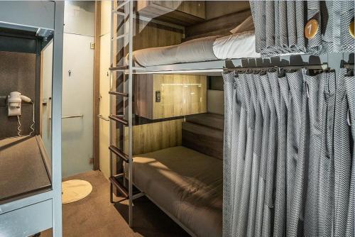 a couple of bunk beds in a room at Coller Boutique Hostel in Singapore