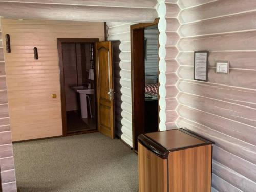 a hallway of a room with a door and a sink at Готель Жди ня Єво instagram zhdenievo hotel in Zhdenievo