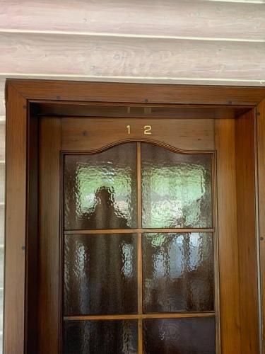 a door with a glass window on top of it at Готель Жди ня Єво instagram zhdenievo hotel in Zhdenievo