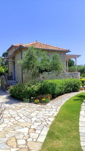 a house with a stone walkway in front of it at PANORAMA VILLA'S in Levktron