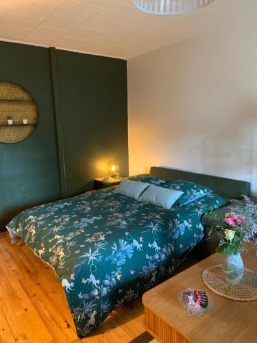 A bed or beds in a room at La Ferme du Puy d'Or