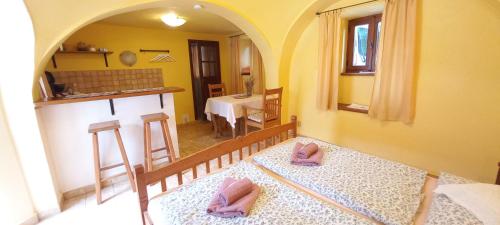 a room with two pink slippers on the floor of a room at Penzion Merlin in Český Krumlov