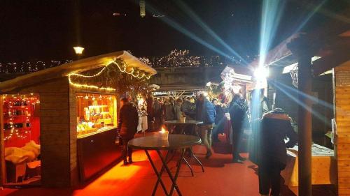 a crowd of people walking around a market at night at Libenliny in Durbuy
