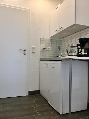 Η κουζίνα ή μικρή κουζίνα στο H&E Apartments