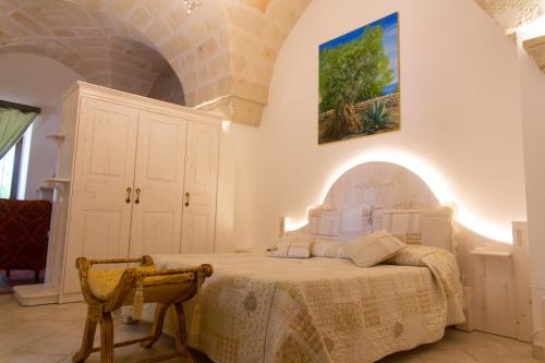 En eller flere senge i et værelse på Villa Tonia