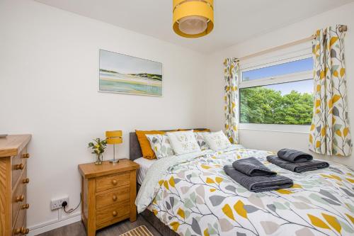 a bedroom with a bed and a window at 328 Norton Park, Dartmouth in Dartmouth