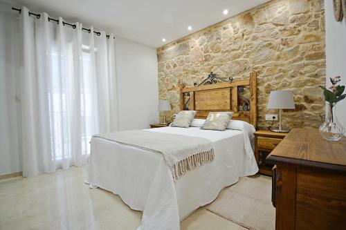 Ένα ή περισσότερα κρεβάτια σε δωμάτιο στο Preciosa casa marinera en Carril