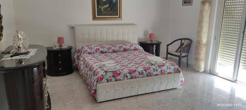 Postel nebo postele na pokoji v ubytování Mary Home 1 a pochi passi dalla Reggia di Caserta