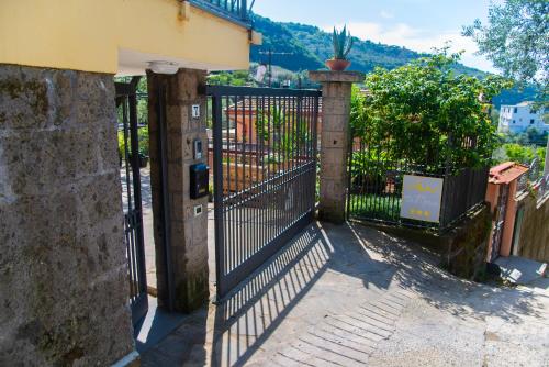an iron gate with a plant on top of it at ON' MICHELE GUEST HOUSE in Sorrento