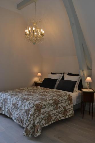 Posteľ alebo postele v izbe v ubytovaní L'Orangerie, Château St Justin
