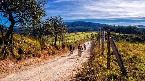 a group of people riding bikes down a dirt road at Hotel & Bildungszentrum Matt in Schwarzenberg