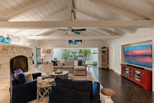 a living room with a couch and a fireplace at Siesta Key Island Rentals in Siesta Key